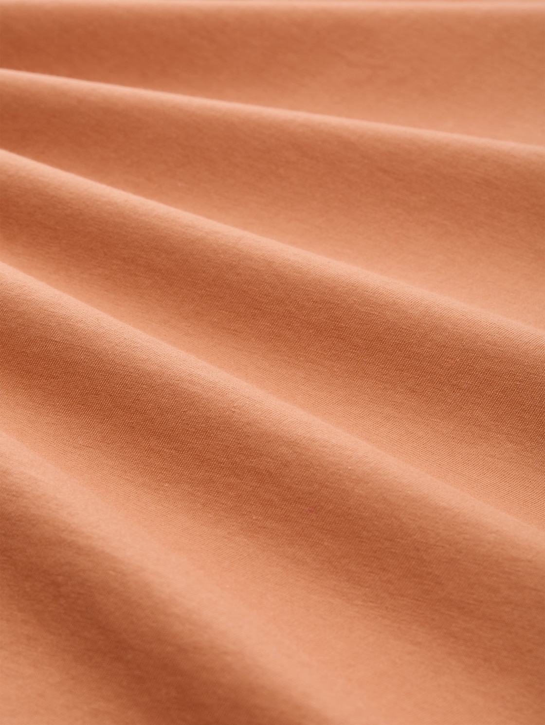 T-Shirt mit Print - faded copper orange - Material-Ansicht