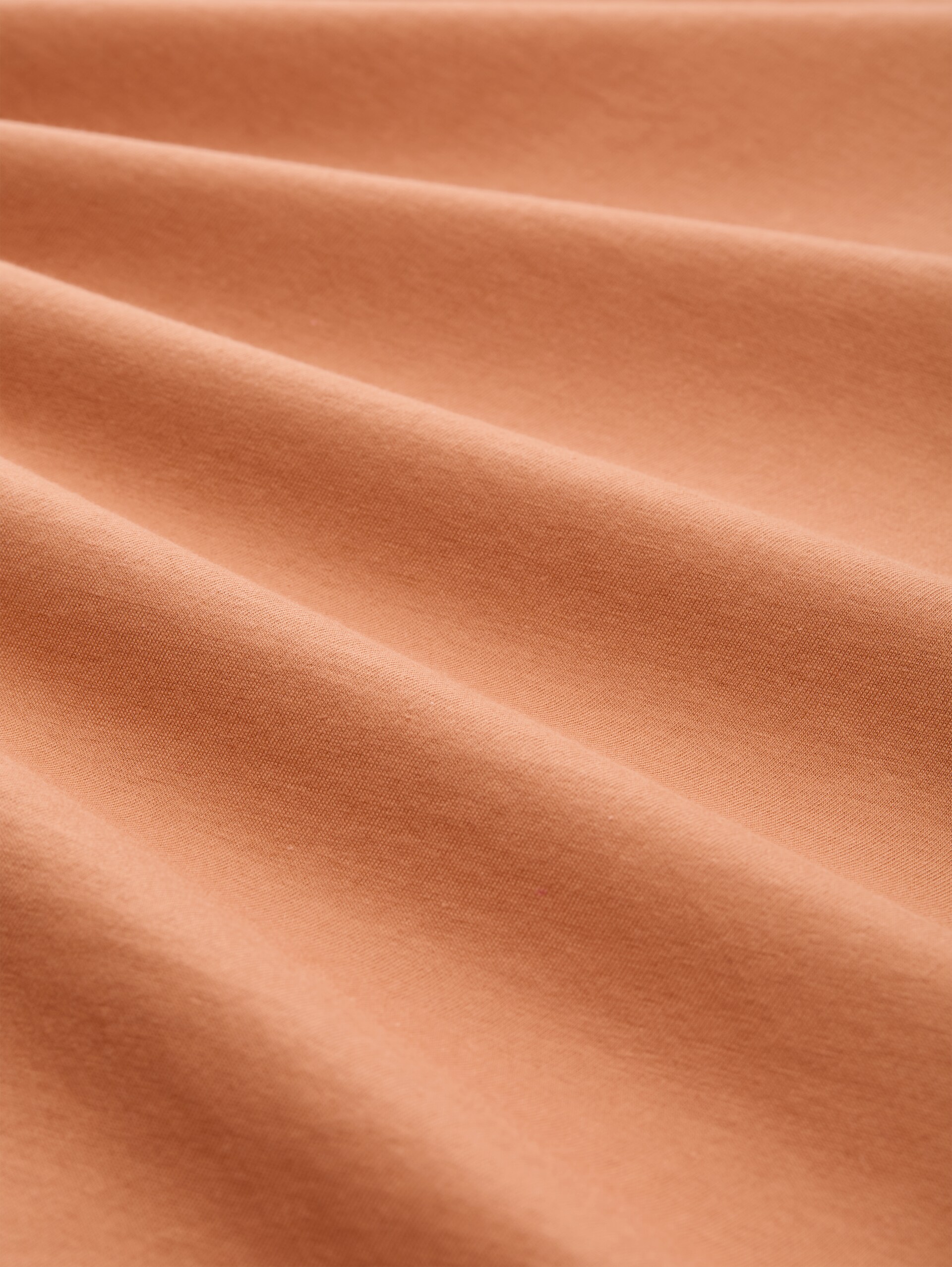 T-Shirt mit Print - faded copper orange - Material-Ansicht
