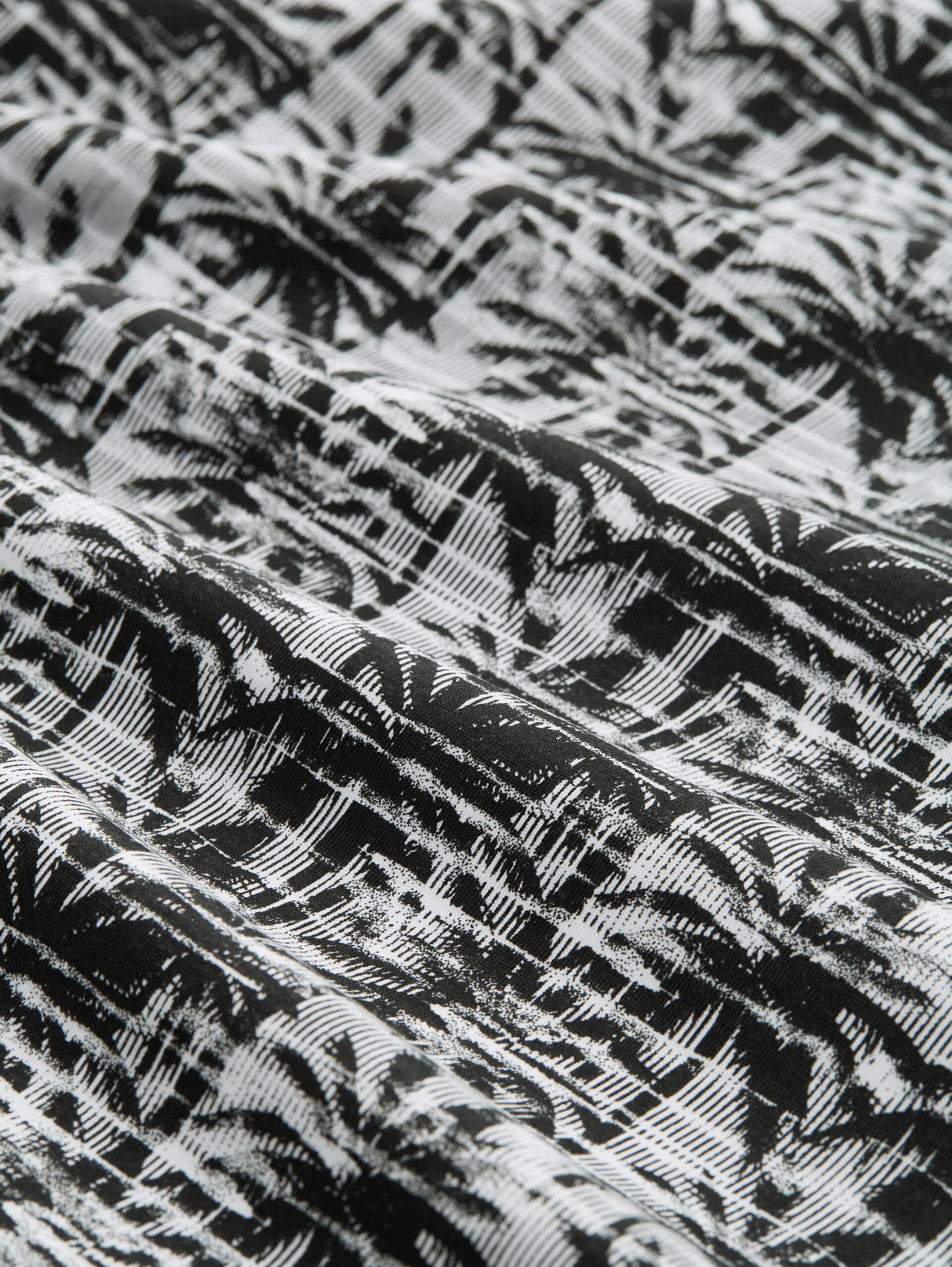 T-Shirt mit Palmenprint - black white stripy palm print - Material-Ansicht