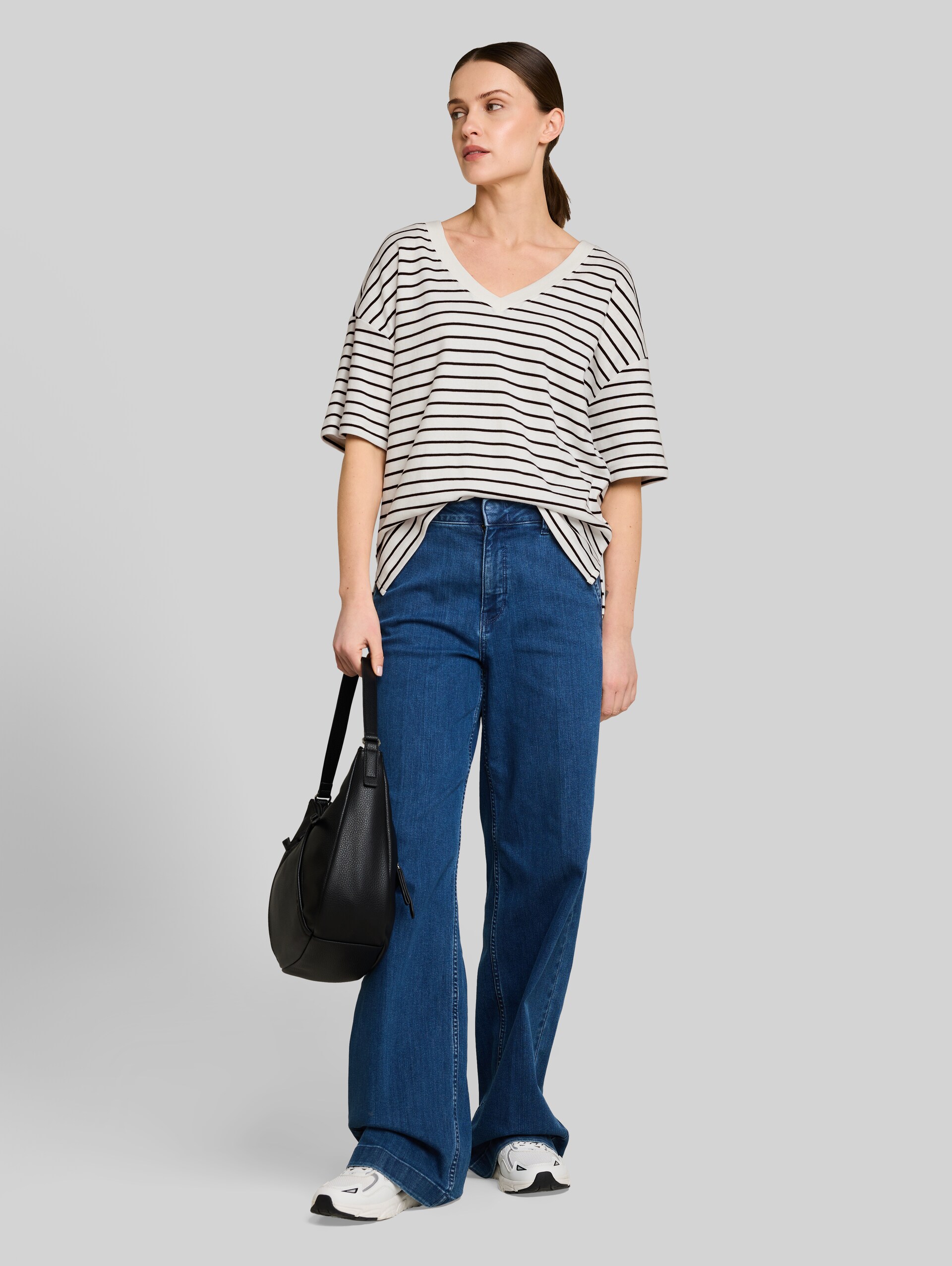 Oversized T-shirt with striped pattern - white navy irregular stripe - Model front view