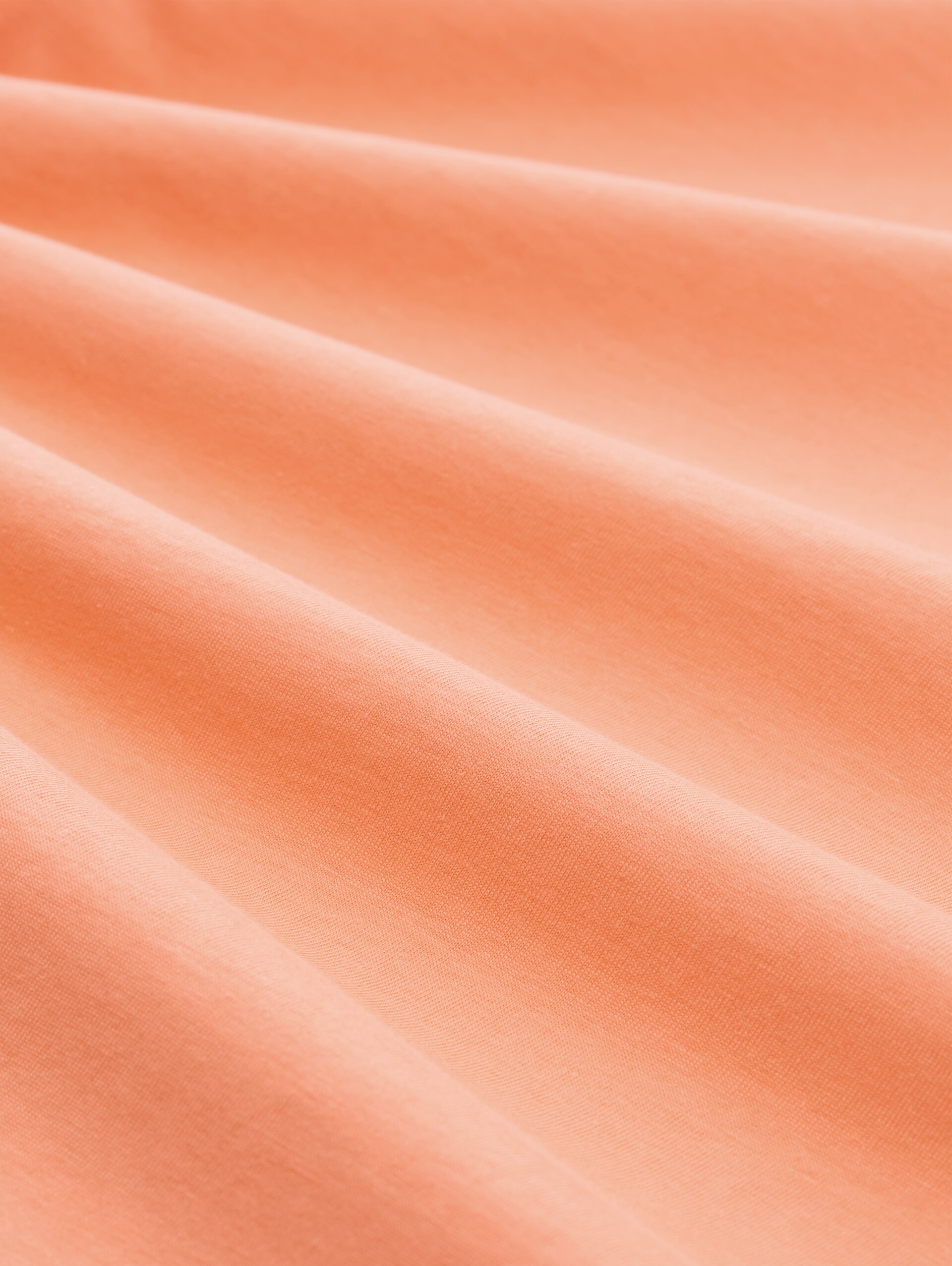T-shirt met borduursel - bright coral - Materiaalweergave