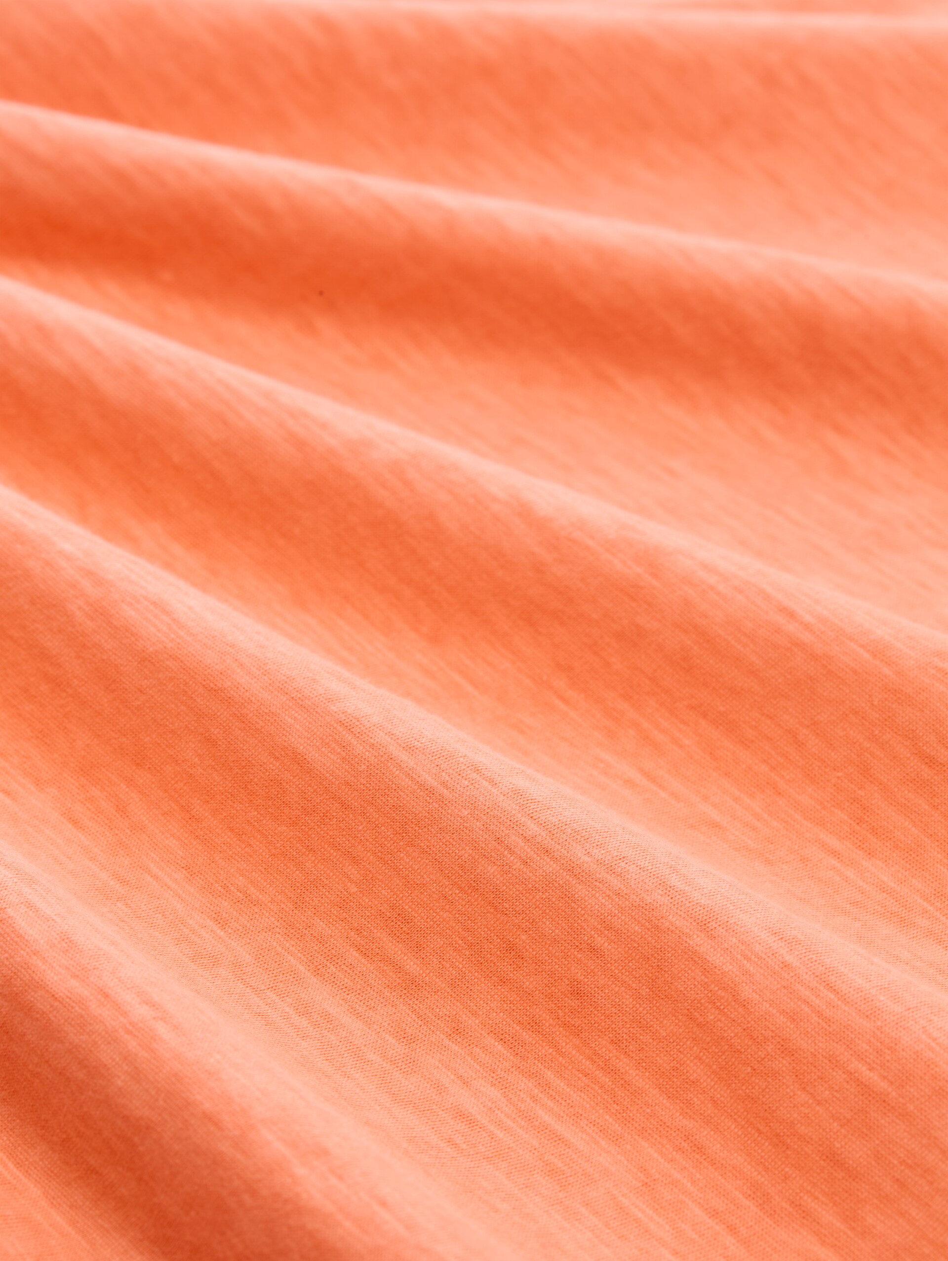 T-shirt van katoen - bright coral - Materiaalweergave
