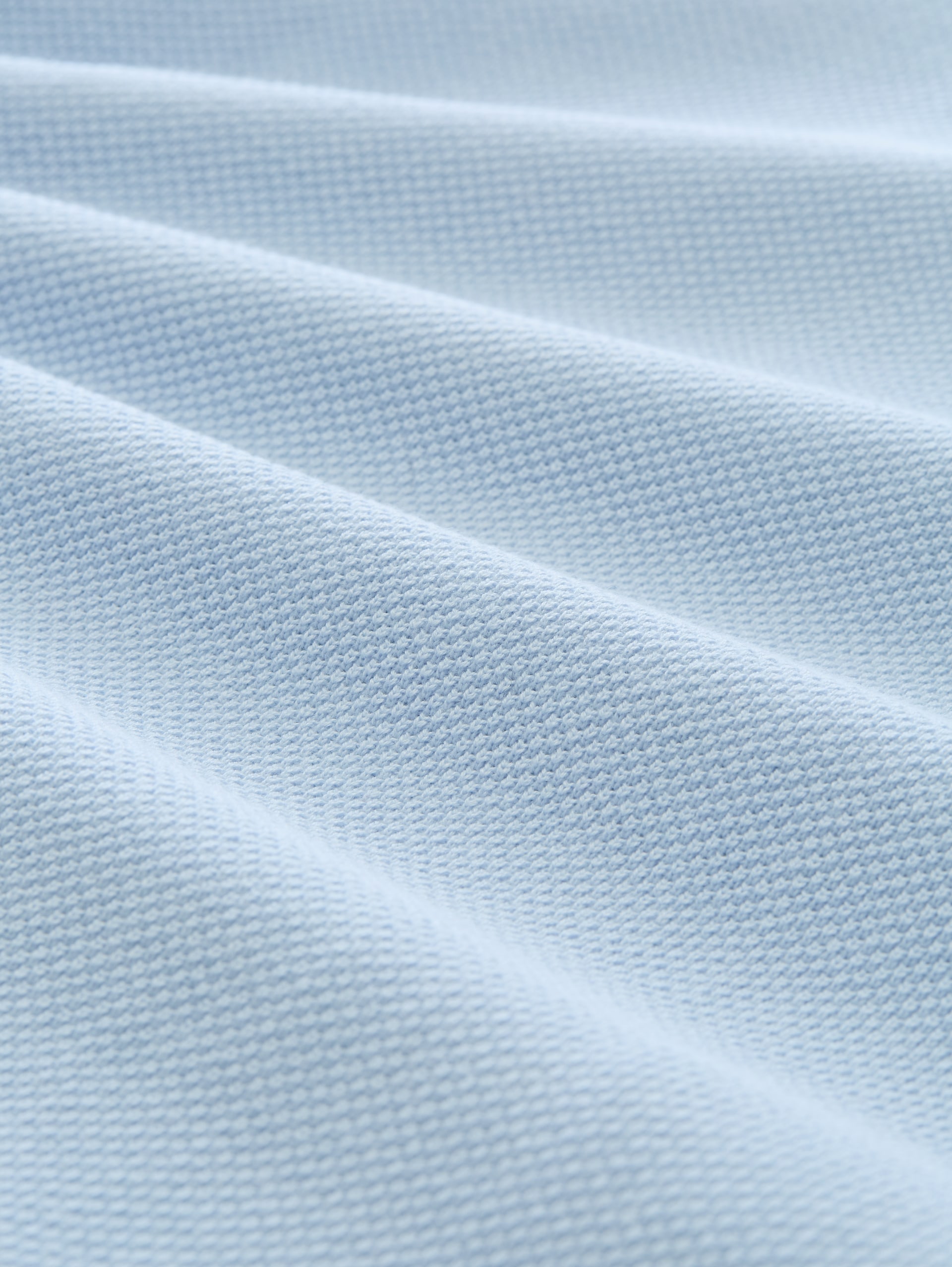 Piqué Strick-Poloshirt aus Baumwolle - Light Metal Blue - Material-Ansicht