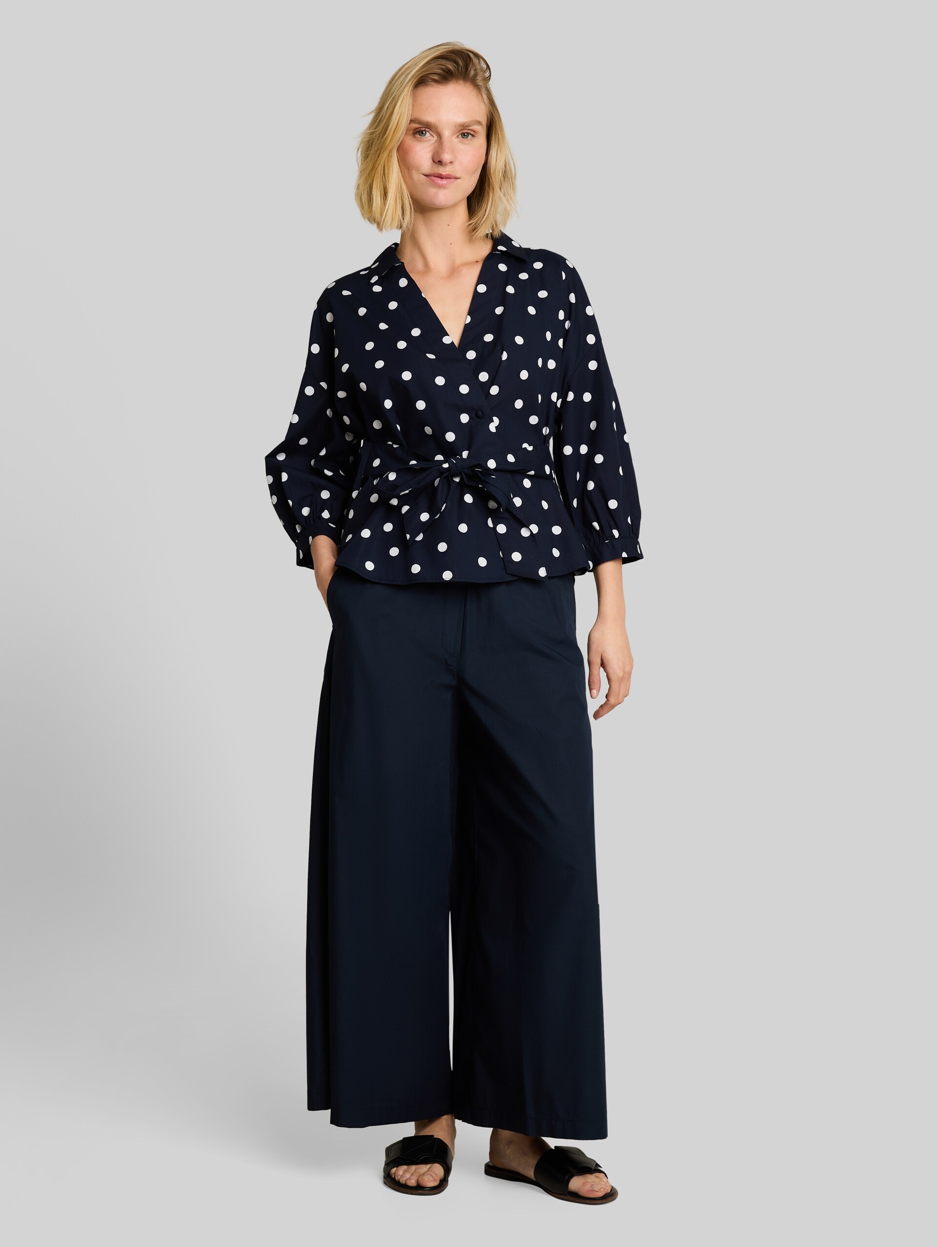 Loose-fit wrap blouse - navy big dot design - Model front view
