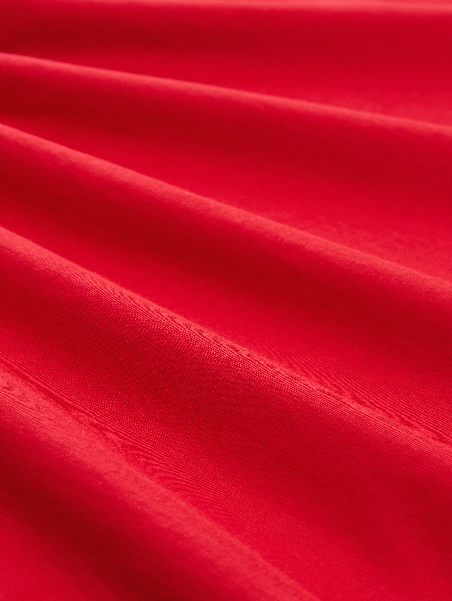 T-Shirt mit Print - soft scarlet red - Material-Ansicht