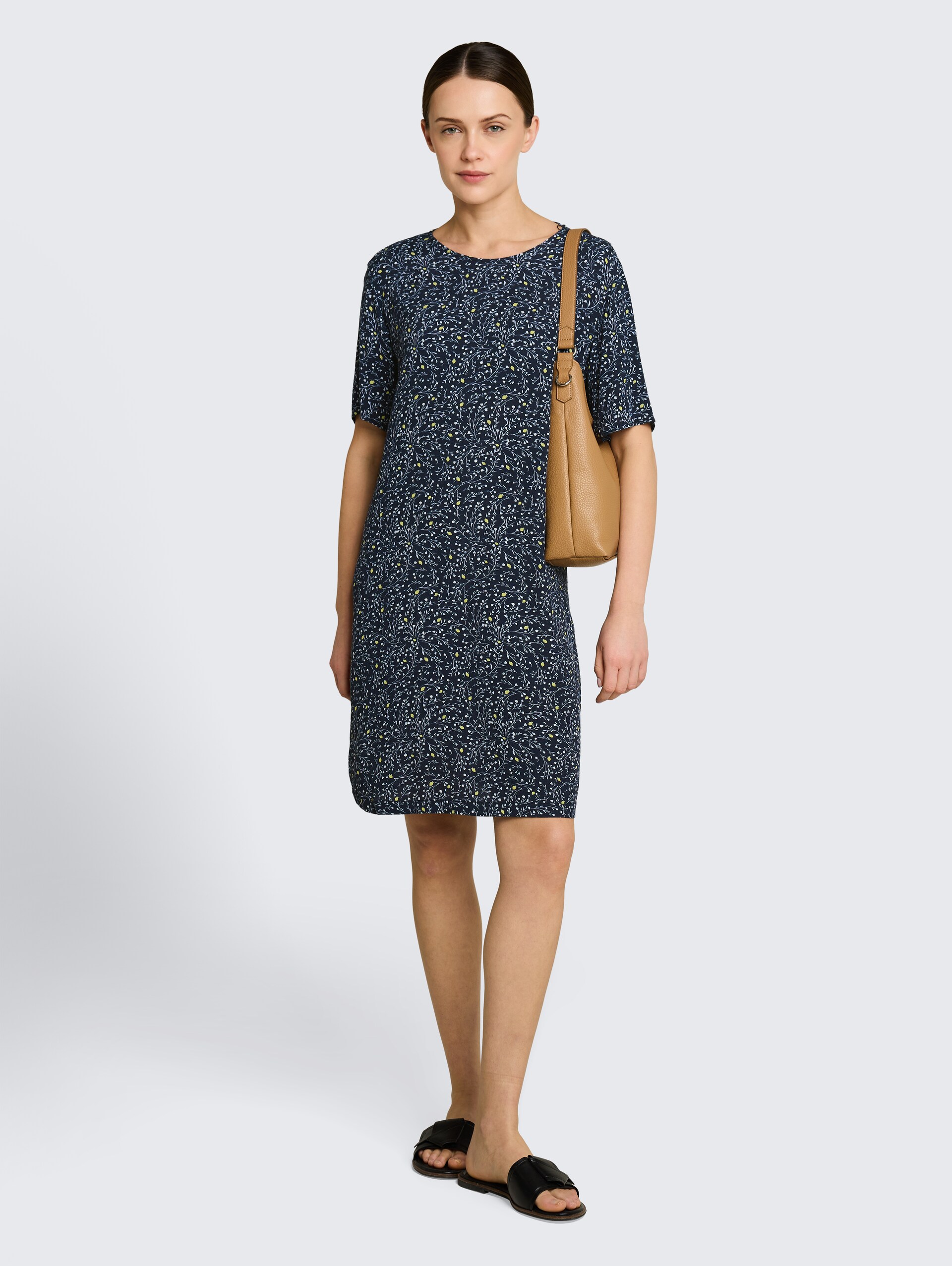 Losvallende jurk met uitsnijdingen - navy small leaves design - zijaanzicht model