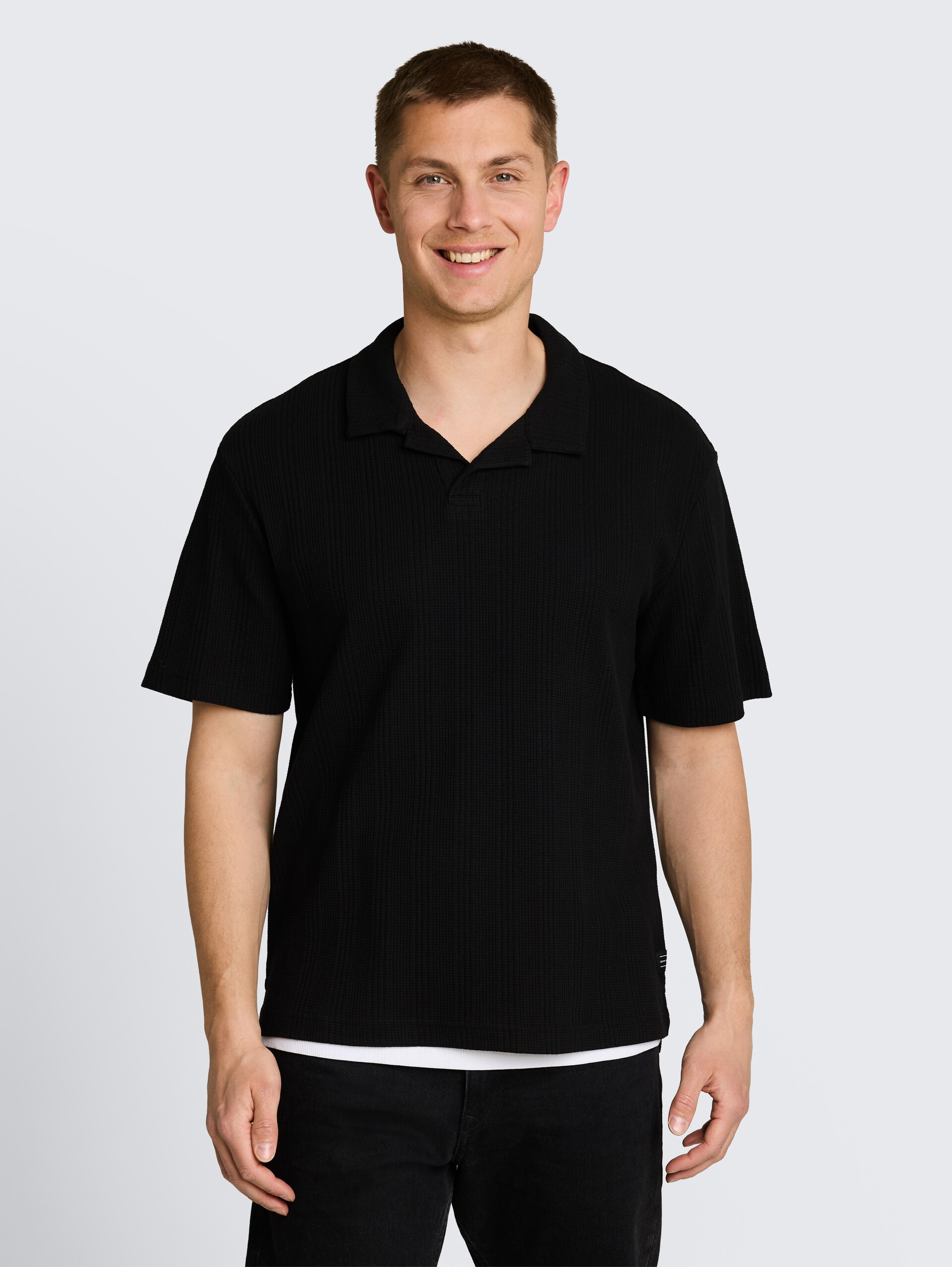 Poloshirt met relaxte pasvorm en wafelstructuur - Black