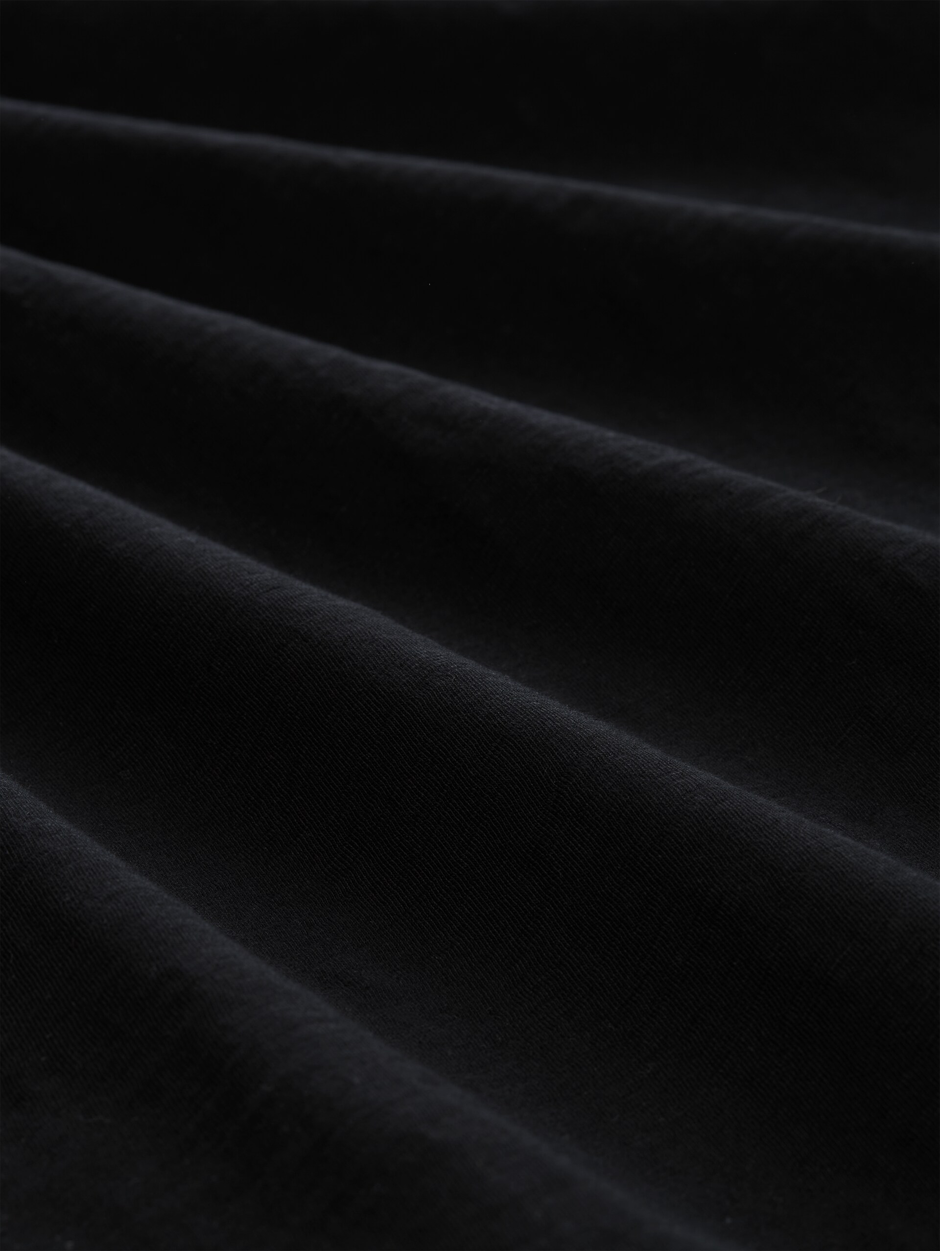 T-Shirt mit Print - Black - Material-Ansicht