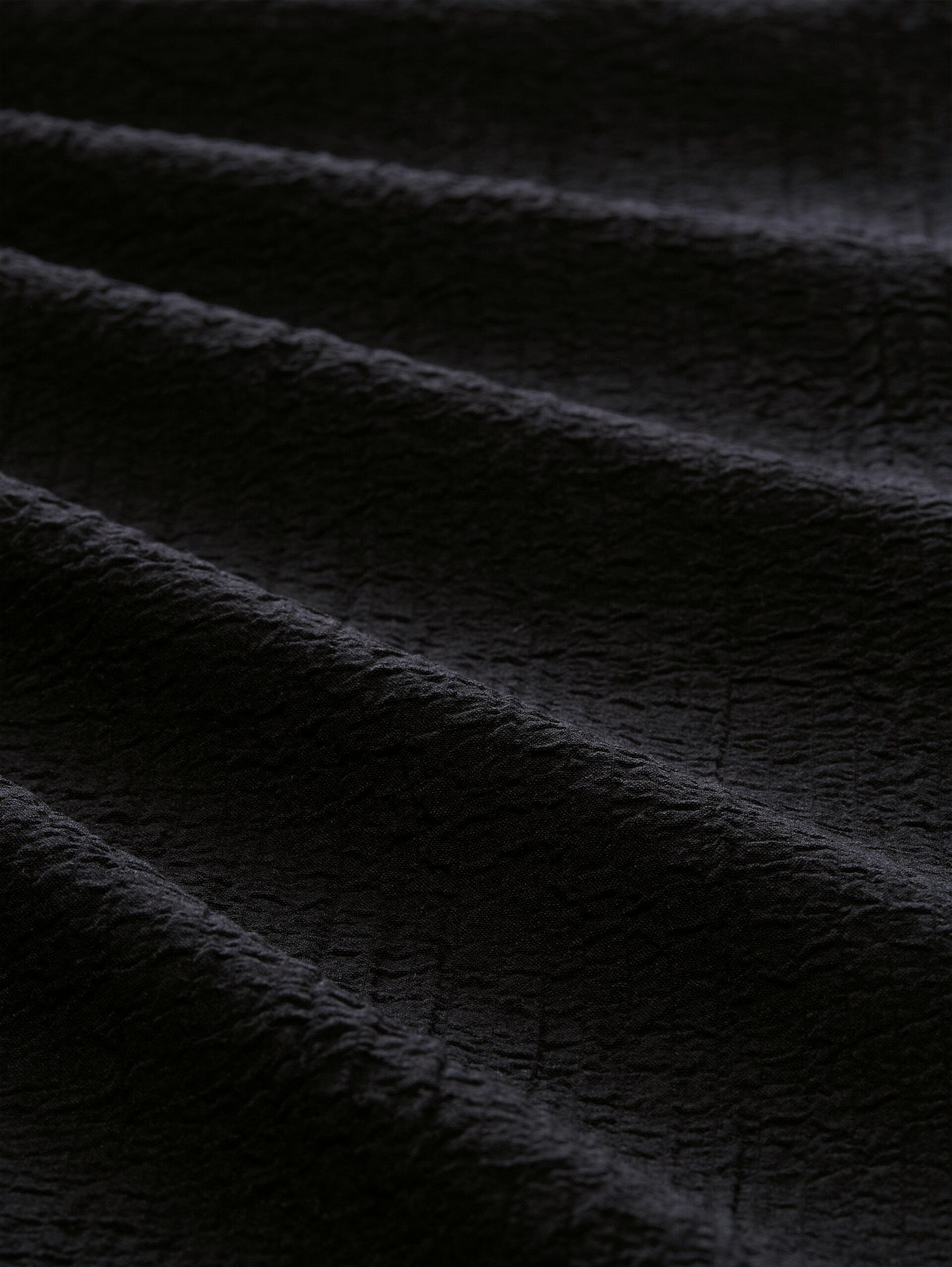 Seersucker broek met wijde pijpen en trekkoord - deep black - Materiaalweergave