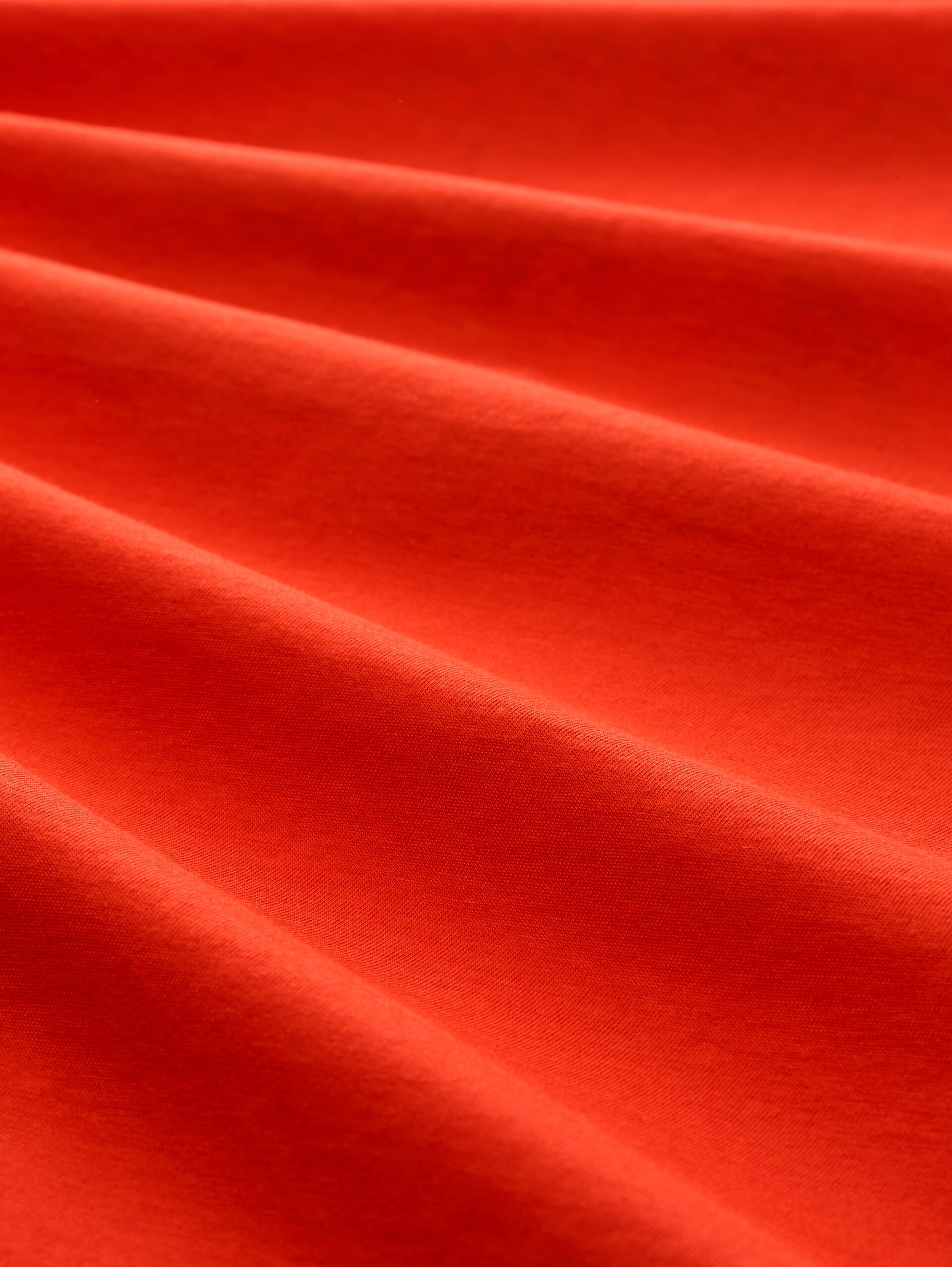 T-Shirt mit Print - orange red - Material-Ansicht