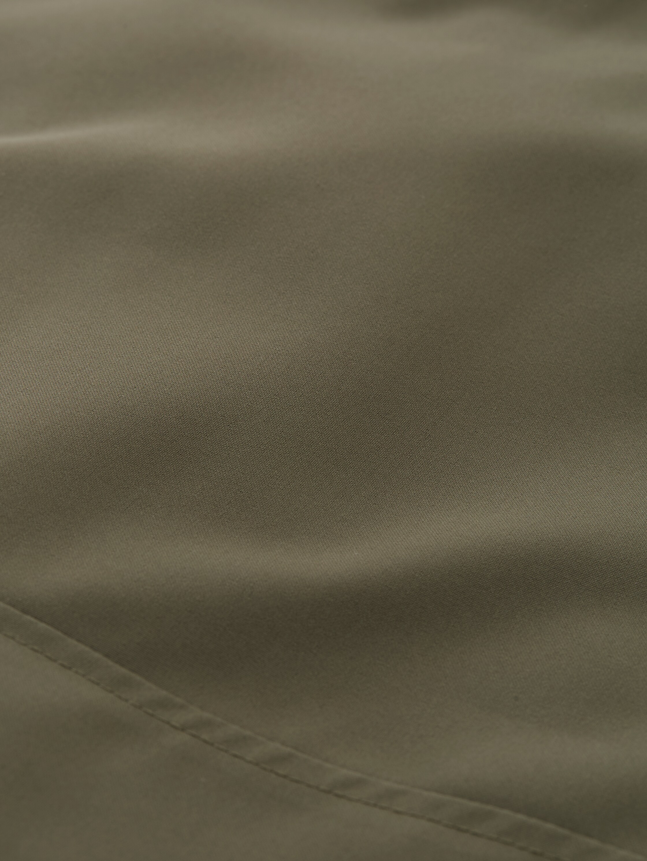 Plus Size - Blouson Jacke mit verstaubarer Kapuze - faded leaf green - Produkt-Detail-Ansicht