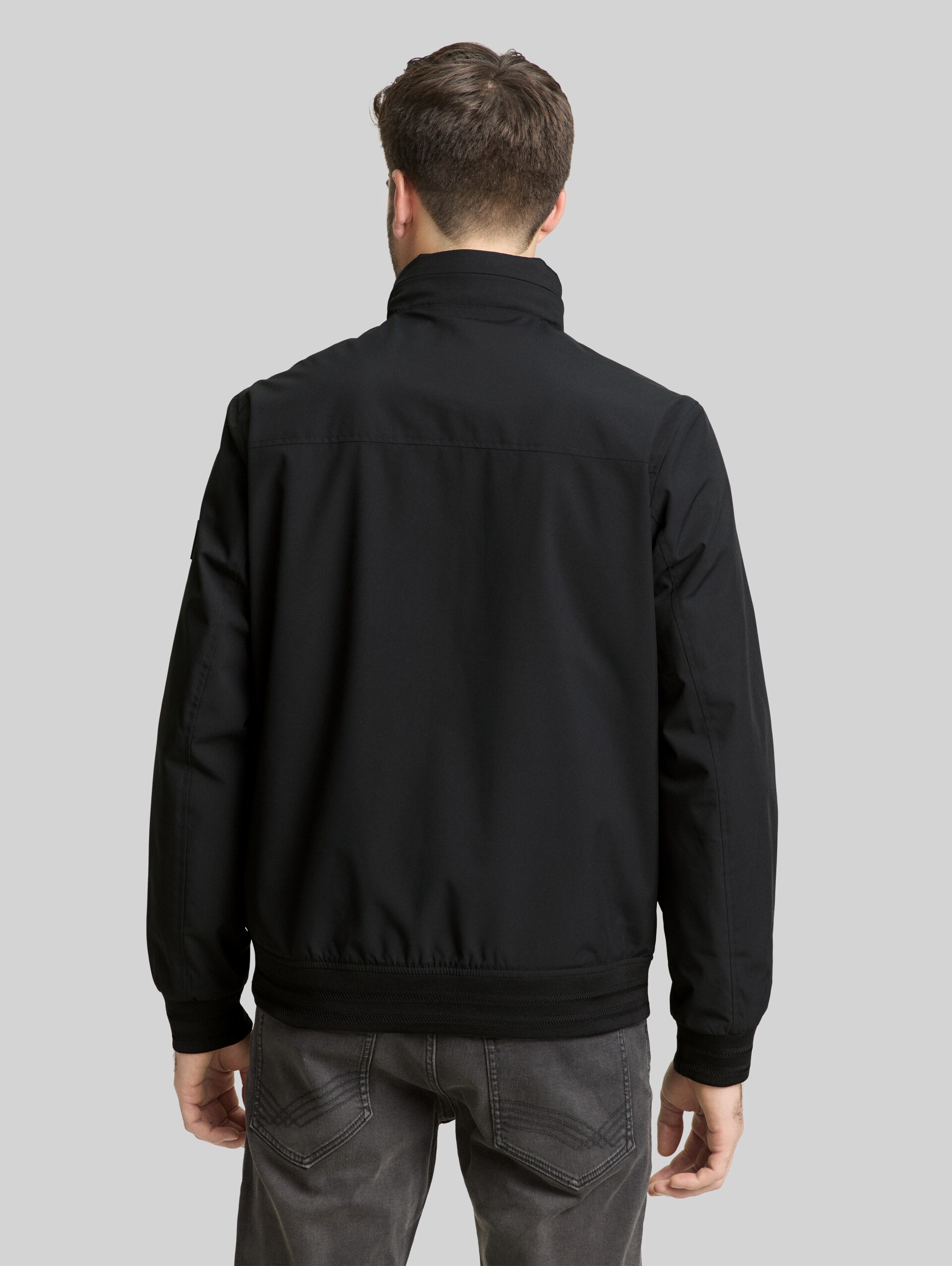 Blouson jacket with stowable hood - Black - Model-back view