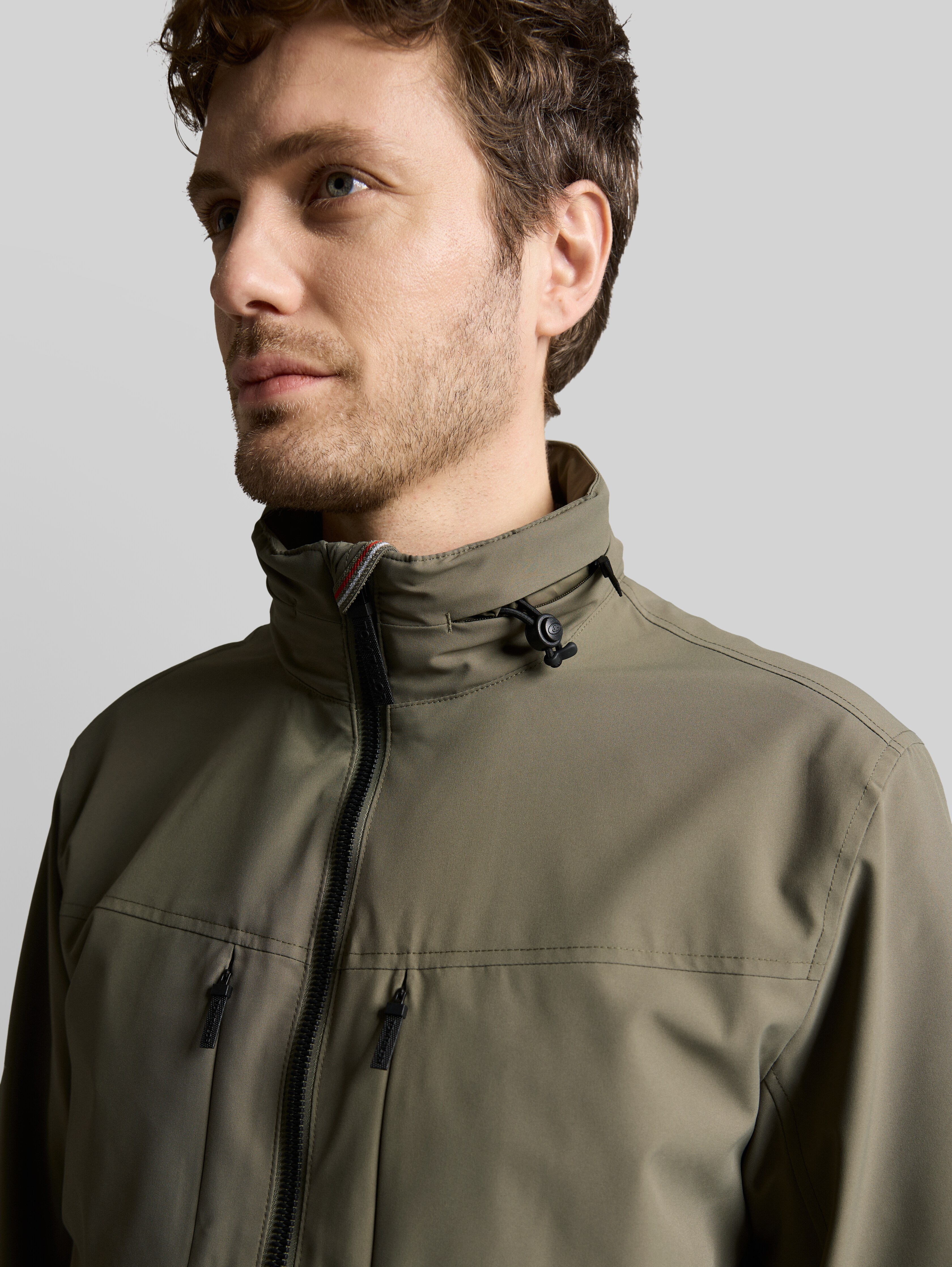 Blouson jacket with stowable hood in green by Tom Tailor