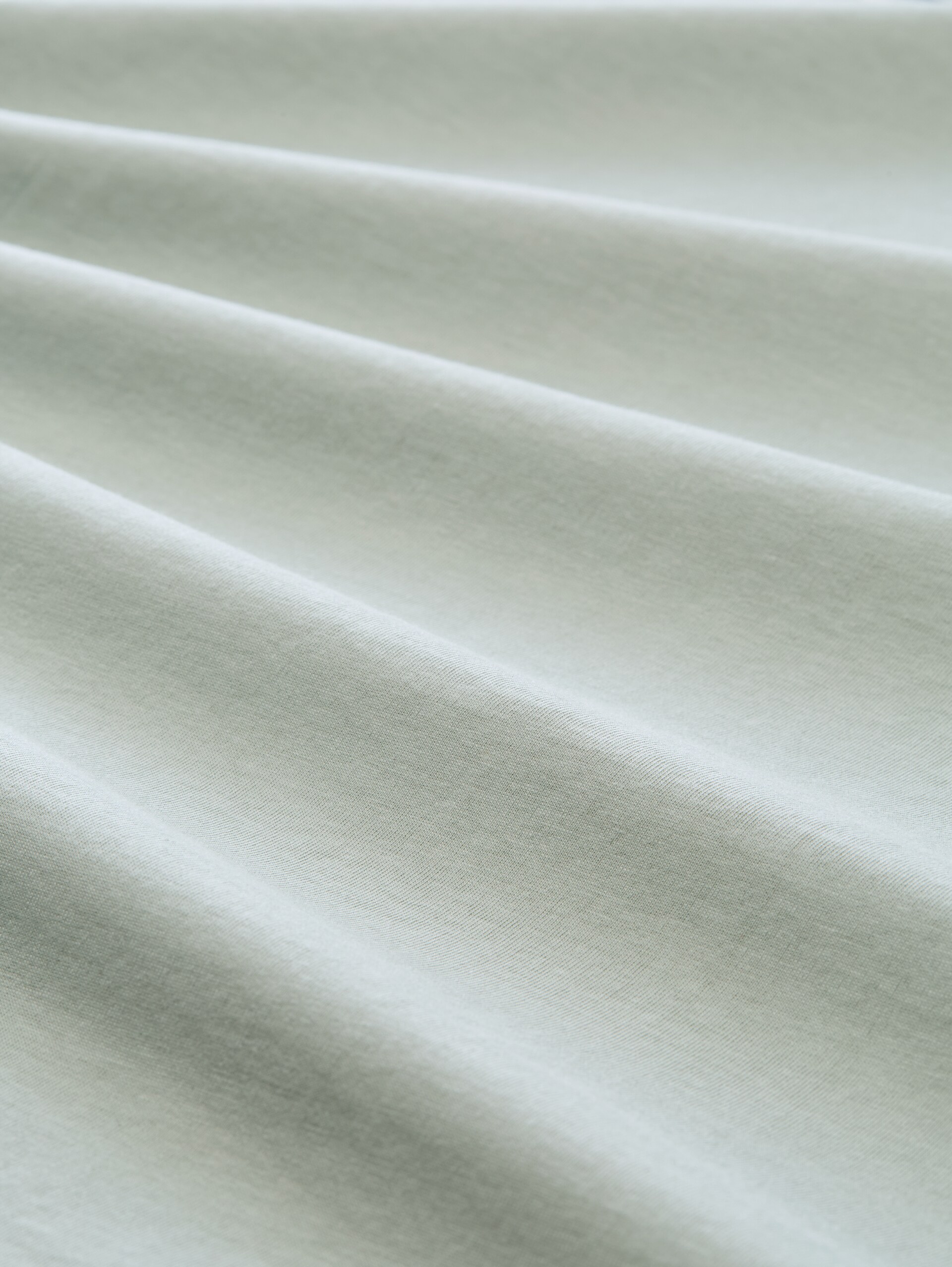 T-Shirt mit Logo-Print - soft greyish green - Material-Ansicht