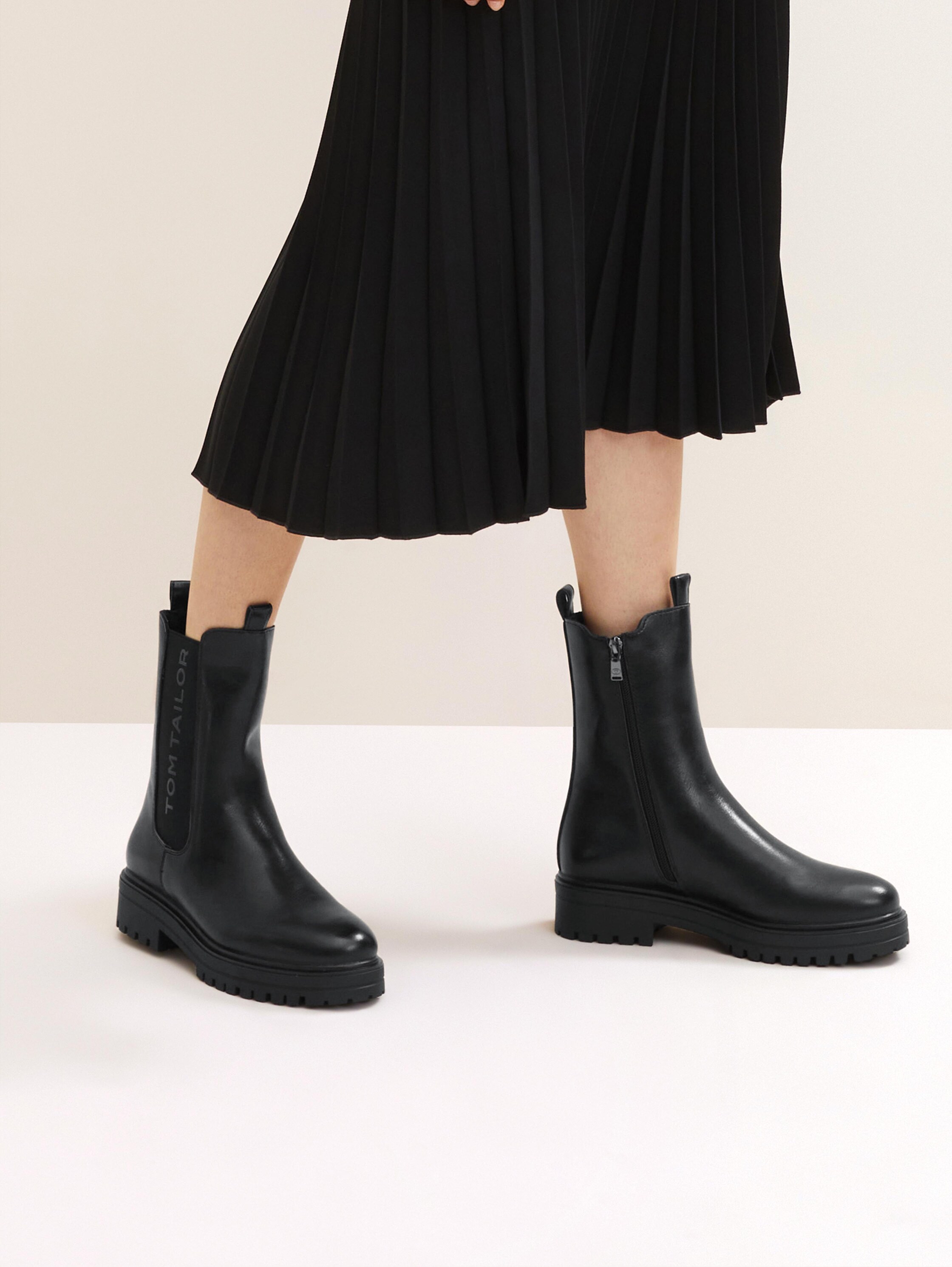 Gefütterte Stiefel mit Gummieinsatz - 1